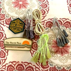 The north face zipper pulls and two patches